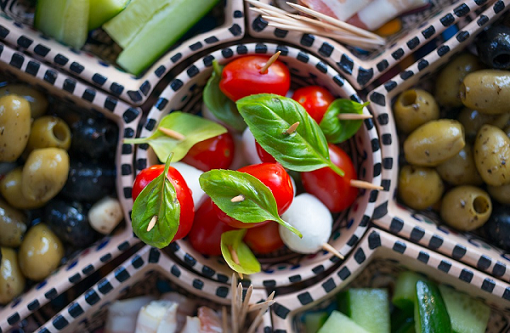Basil, tomato and mozzarella salad with olive oil dressing Basil, tomato and mozzarella salad with olive oil dressing
